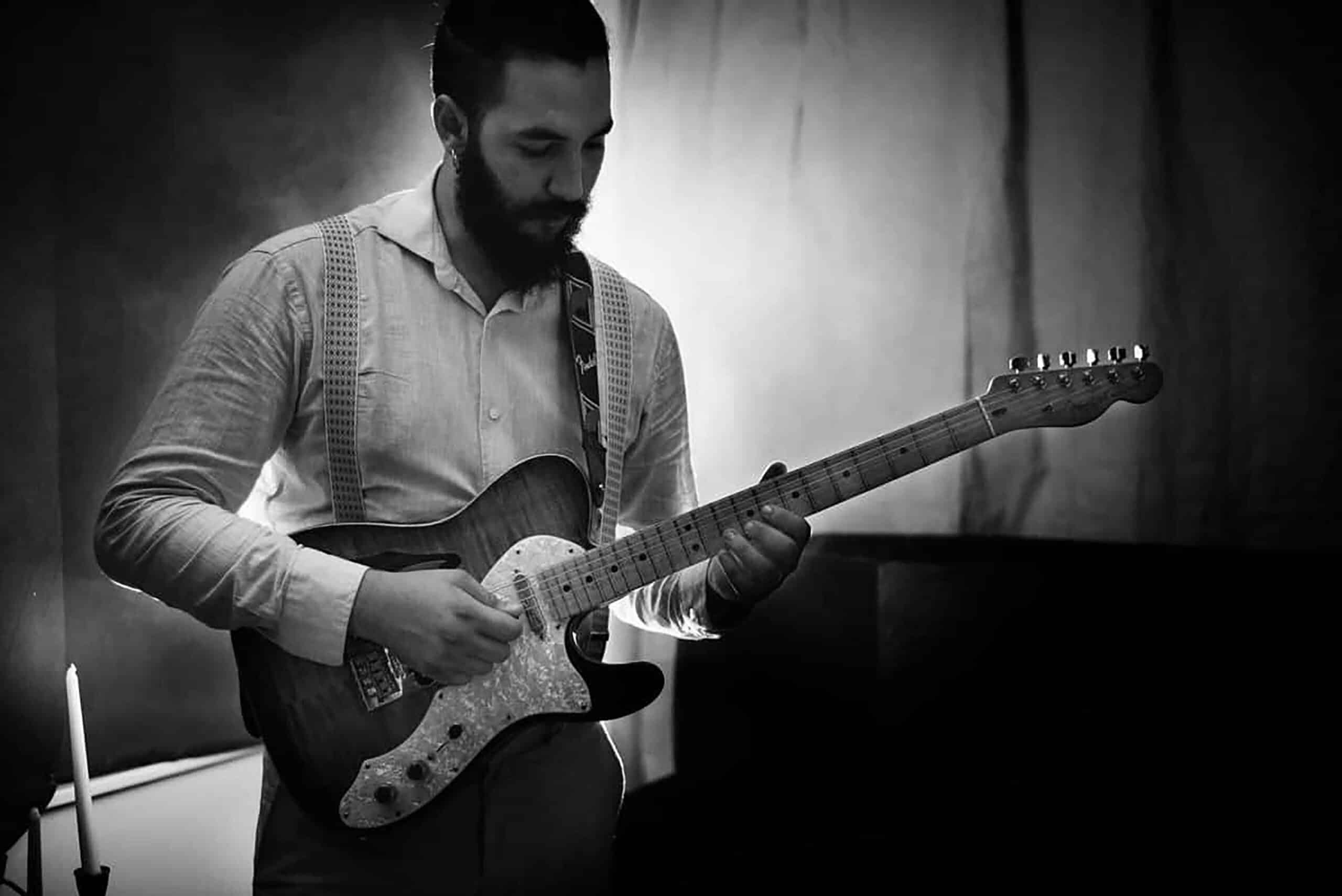 Ricky Castillo performing live Latin jazz guitar at a New York City venue